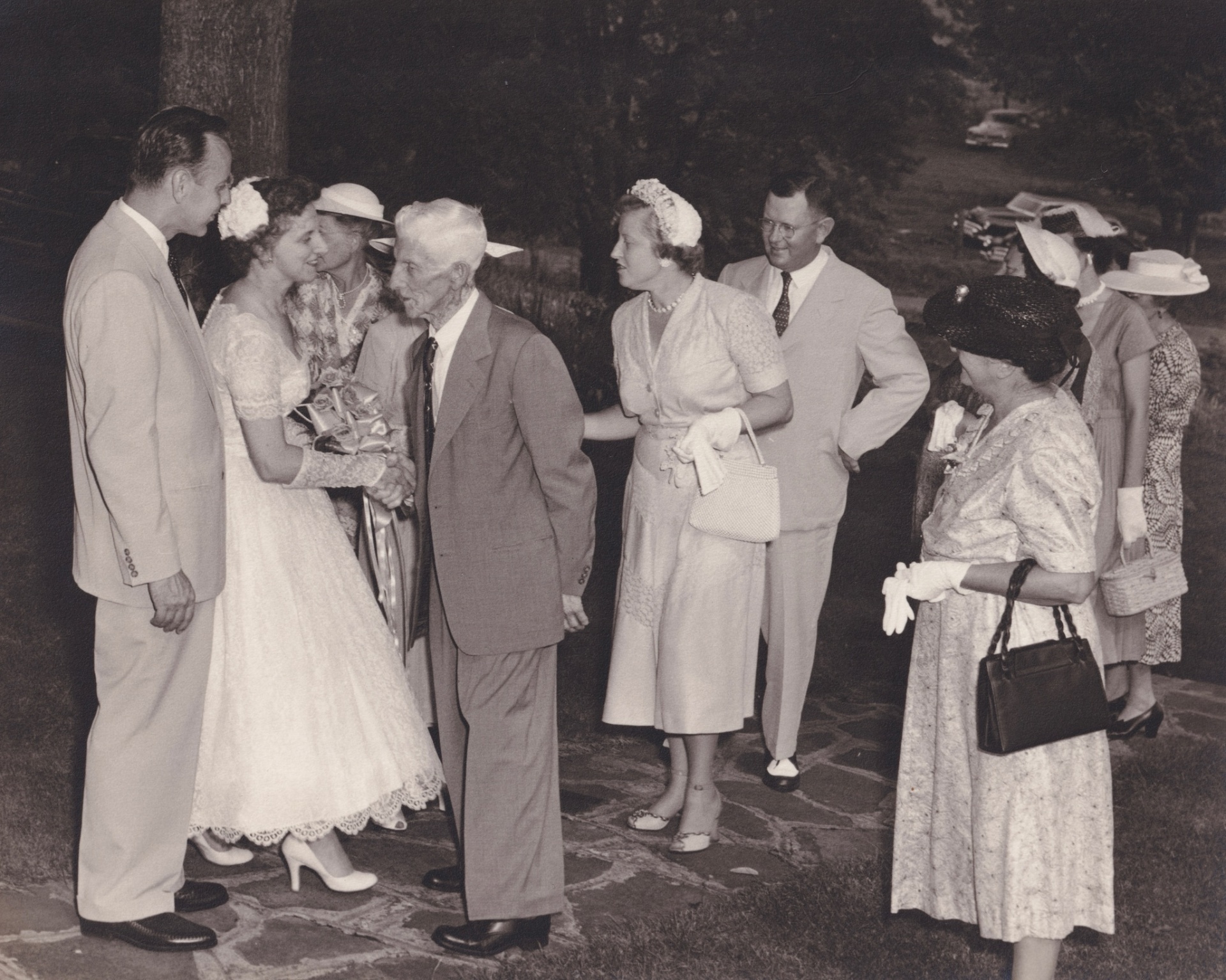 Myrtle Logan greeting guests in a receiving line at her wedding