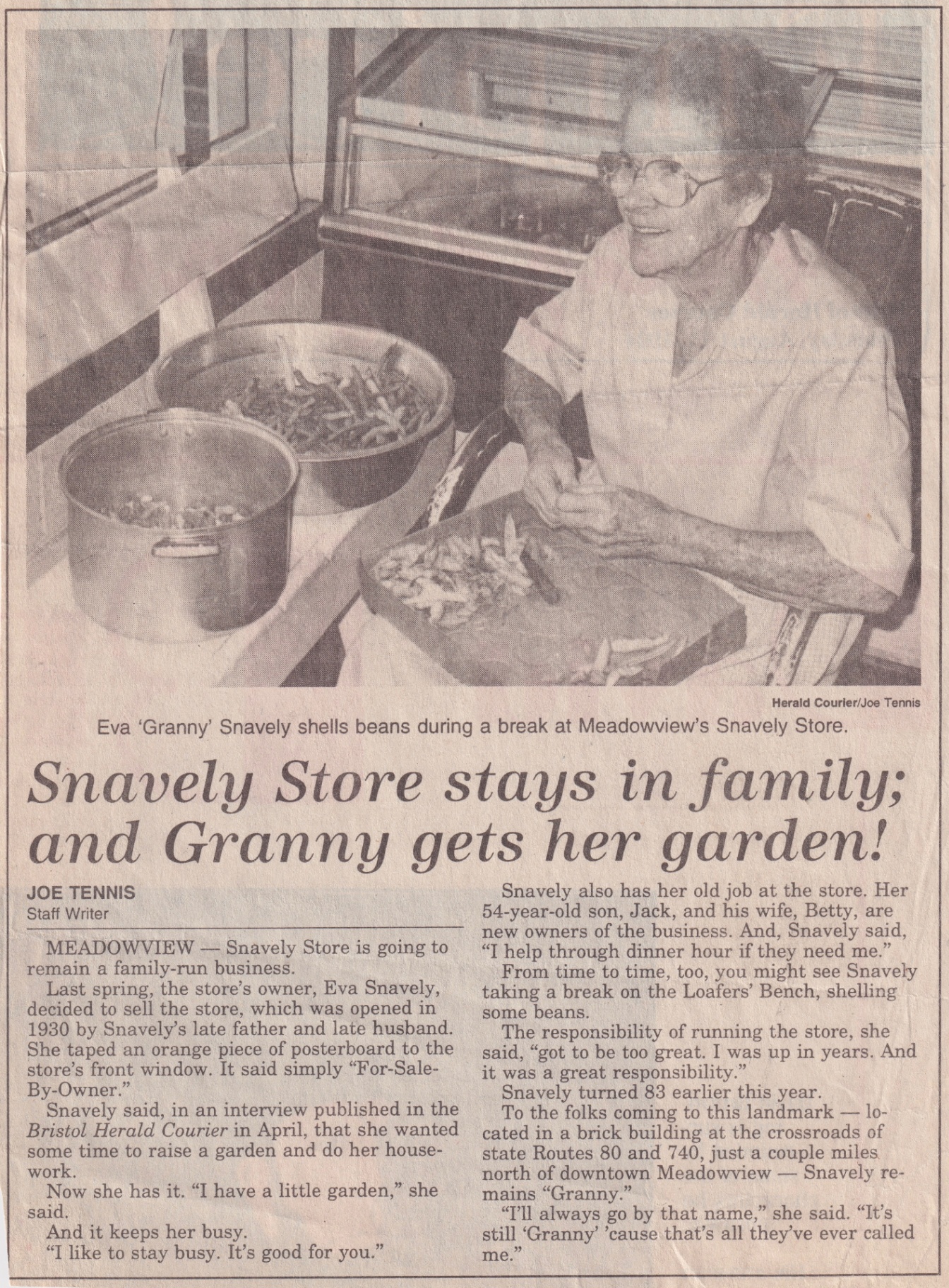 Bristol Herald Courier article by Joe Tennis: 'Snavely Store stays in family; and Granny gets her garden!' featuring Eva 'Granny' Snavely shelling beans at Meadowview's Snavely Store